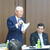 あいさつする関会長㊧と近藤内閣審議官