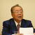 再選された塔野油政連中国支部長