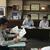 坂本副町長（正面右）にＳＳ過疎地対策などを説明する小林専務理事（左）