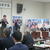 　水口候補(左２人目）を励ます山本県油政連会長（演壇）