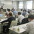 坂井常務らの講演を熱心に聞き入る組合員