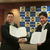 協定書を手に握手する三原愛媛石商理事長（右）と篠原英樹愛媛県警察本部長