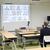 新入社員の映像を見ながら講話する関社長