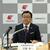 記者会見する木藤社長