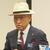 感謝の言葉を述べる亀井前理事長